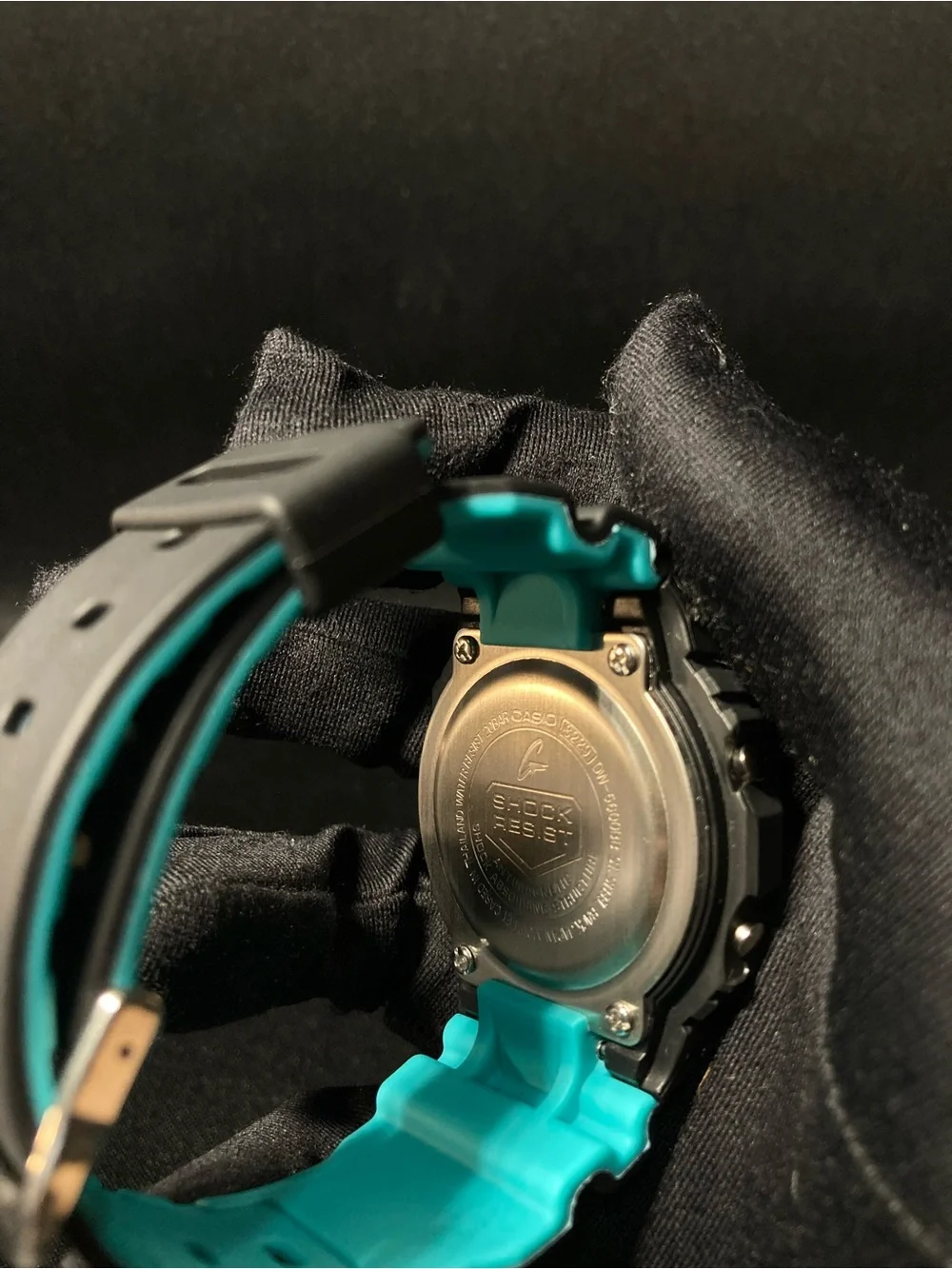 Teal and Black G Shock Dw5600